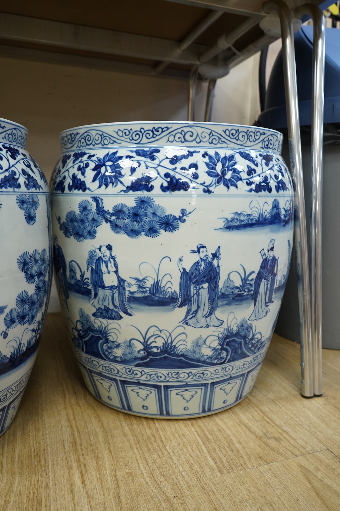 A large pair of Chinese blue and white planters, 43cm high.